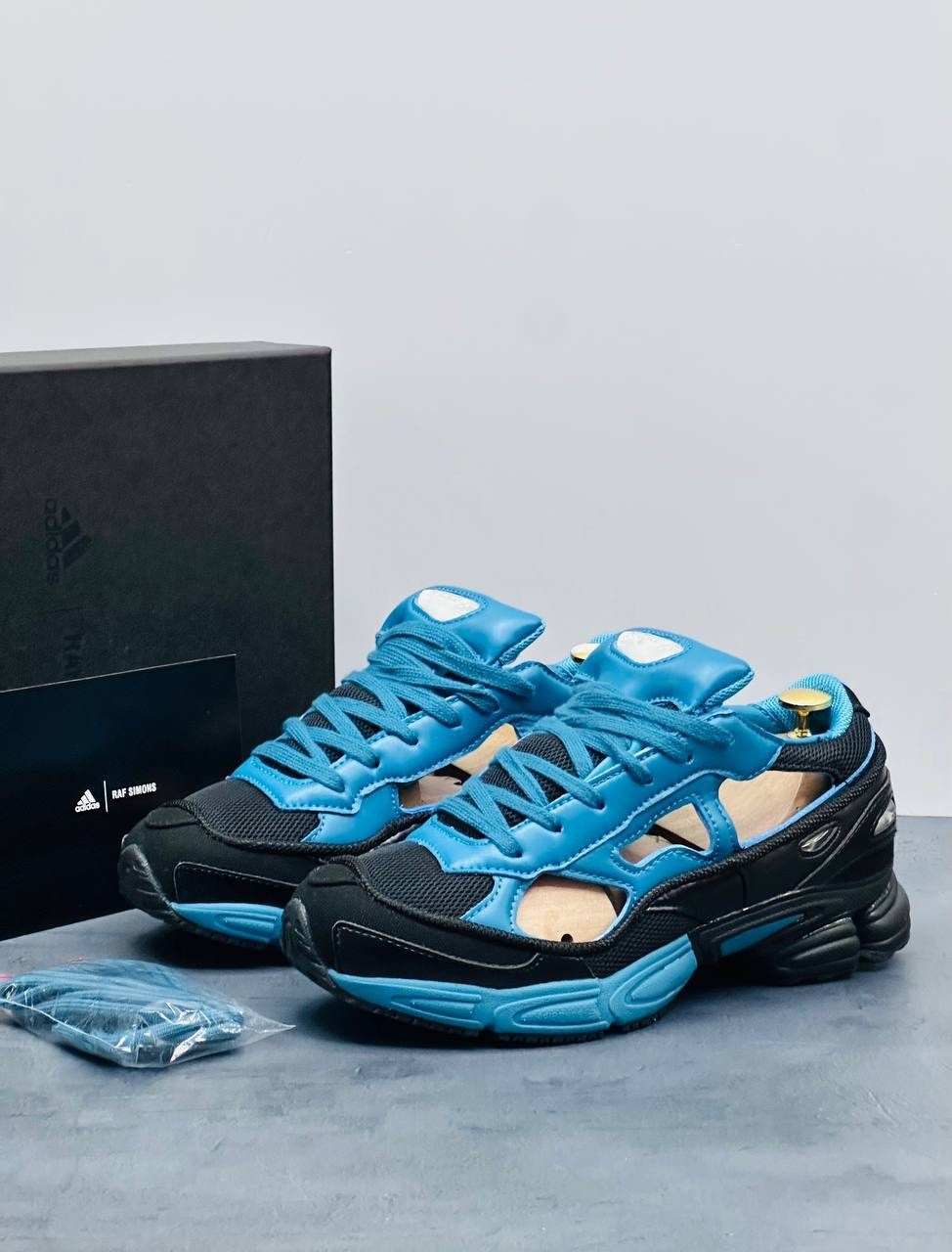 raf simons x adidas replicant ozweego,adidas raf simons x replicant ozweego black colonial blue,adidas raf simons ozweego replicant,adidas x raf simons rs replicant ozweego limited edition teal black,