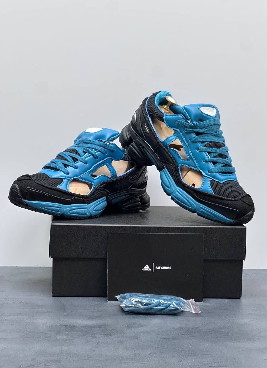 raf simons x adidas replicant ozweego,adidas raf simons x replicant ozweego black colonial blue,adidas raf simons ozweego replicant,adidas x raf simons rs replicant ozweego limited edition teal black,