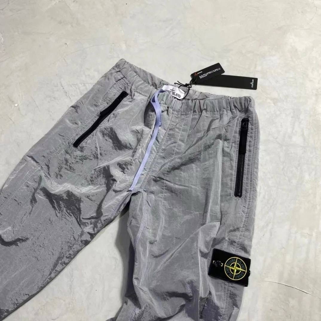 спортивные штаны stone island,штаны stone island,штаны стон айленд,stone island штаны нейлон,штаны легкие stone island nylon metal серебро