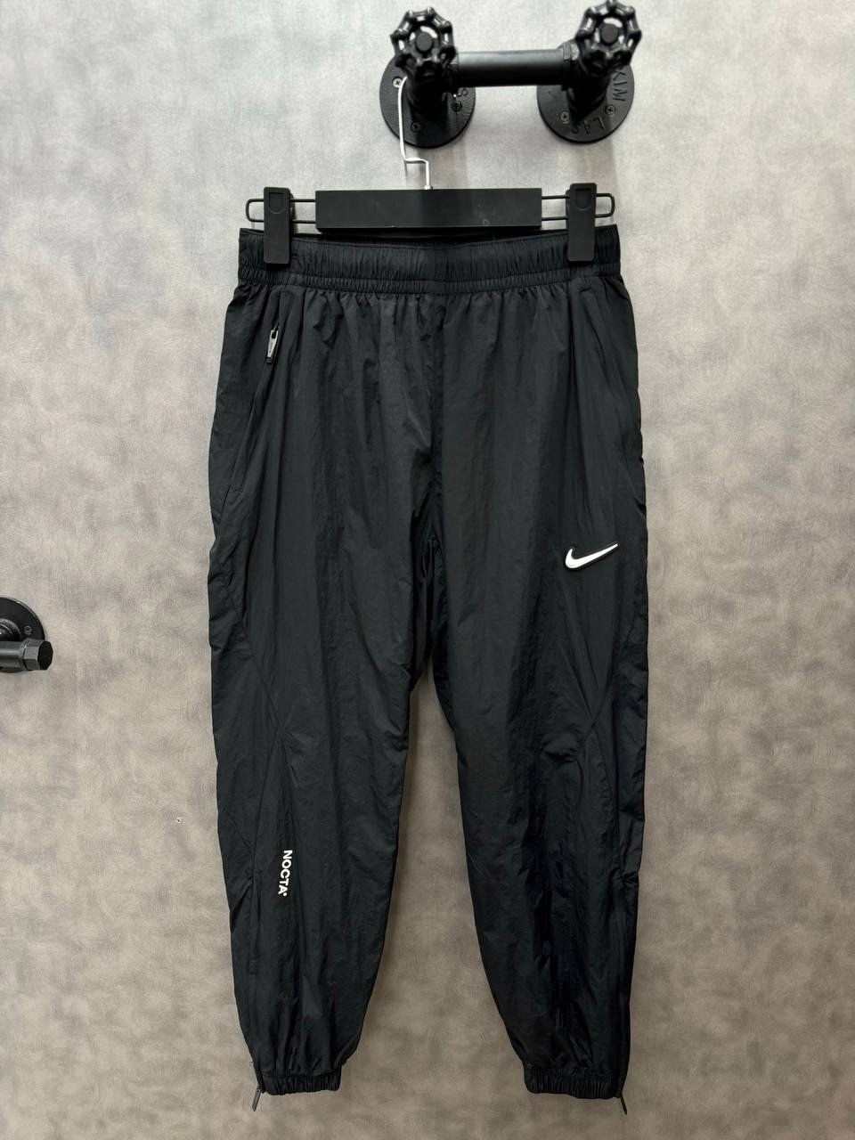 спортивные брюки nike,спортивные штаны nike,нейлоновые тренировочные брюки nike nrg nocta с логотипом и карманами,брюки мужские nike,штаны спортивные мужские nike